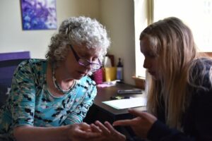 Dr. Maggie Fox, ND, consulting with a patient